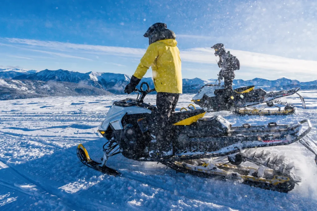 Riders on a High Performance guided snowmobile tour near Vail, Colorado.